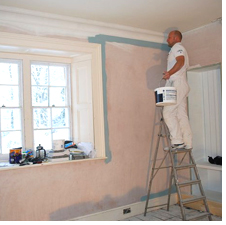 Painting a wall at Boothby Manor